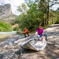 Thumbnail for Aqua Marina Halve Kayak With A Man And Woman Laying Out Their Kayak