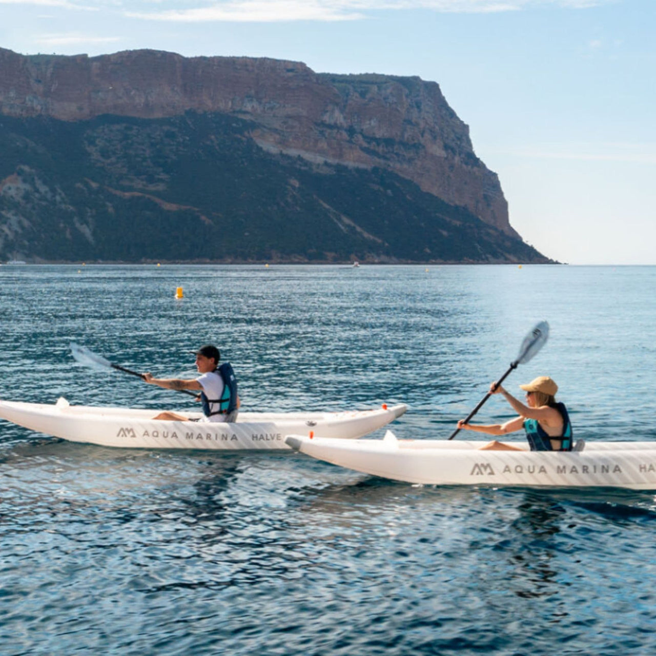 Aqua Marina Halve With A Man And Woman Paddling Calmly