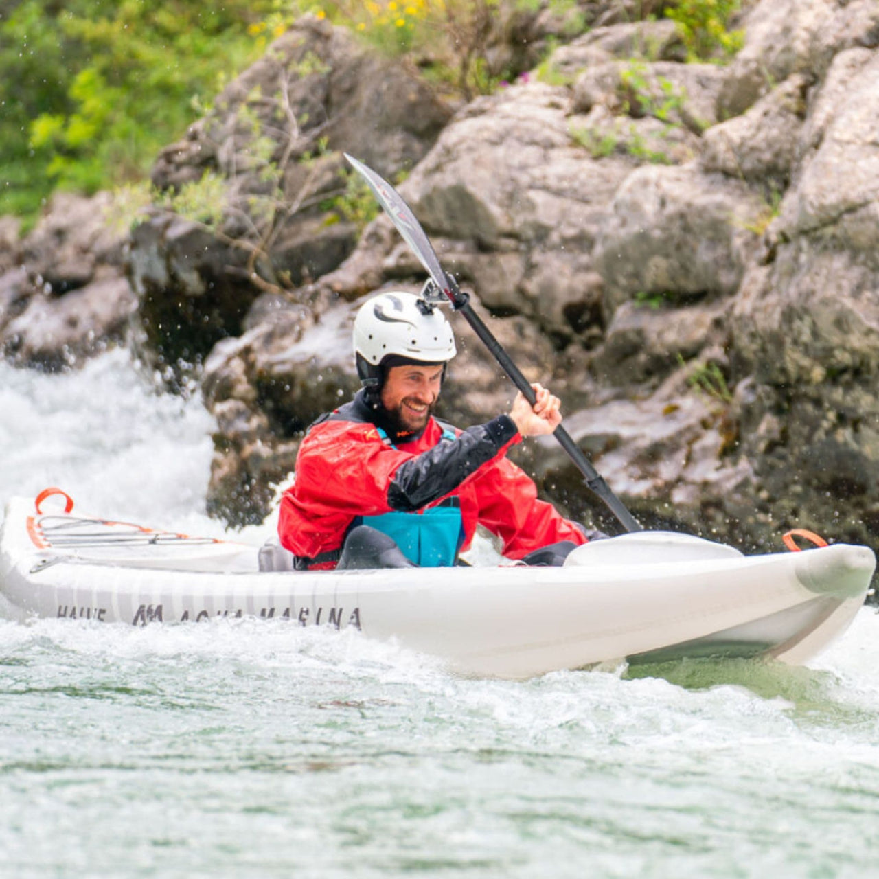 Aqua Marina Halve With A Man Kayaking While Paddling In Strong Currents
