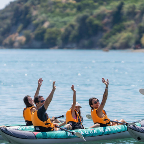 Aqua Marina Laxo 320 With Four Kayakers Smiling and Waving Their Hands