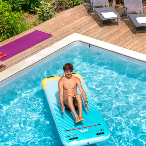 Aqua Marina Peace SUP With A Man Exercising in the Pool