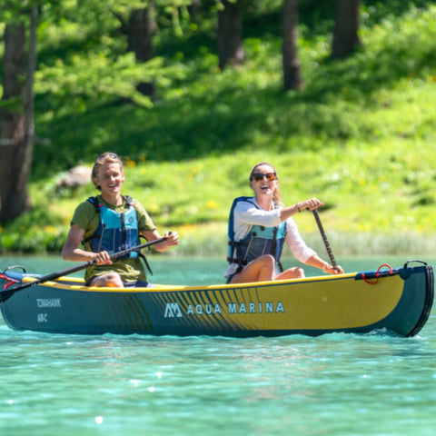 Aqua Marina Tomahawk Air-C Canoe With A Happy Kayaker Couple Paddling The Water