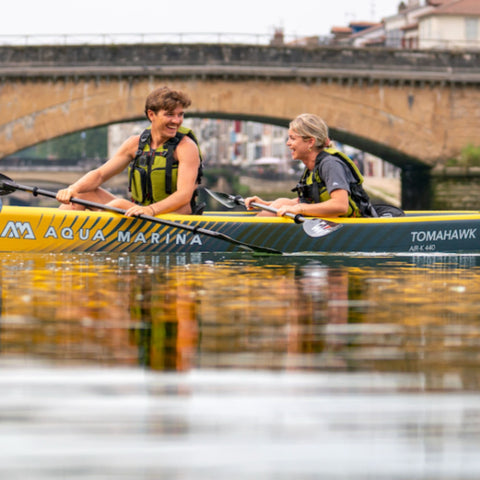 Aqua Marina Tomahawk Air-K Canoe With A Man And Woman Paddling Together
