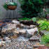 Thumbnail for Aquascape Backyard Landscape Pondless Waterfall Kit With Hanging Flower And Wooden Fence Background