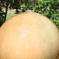 Thumbnail for Ball And Wok Outdoor Water Fountain By Gist Close-up View  With Green Plants Background