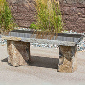 Basalt 48 Garden Bench With Red Brick Wall And Garden Grass In The Background 