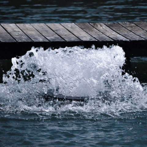 Bearon Aquatics Power House Surface Aerator On The Water Bubbling In Front Of A Pier