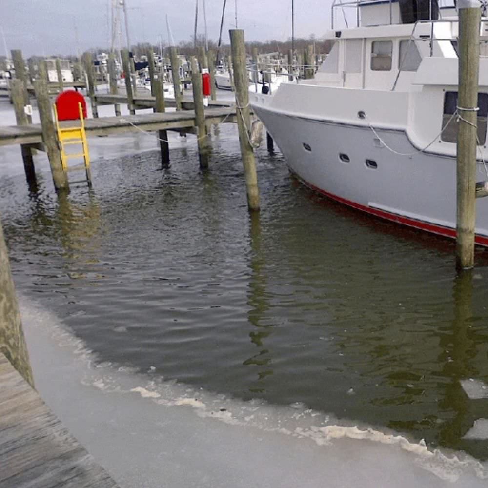 Bearon Aquatics Ice-Eater De-Icer In The Water Next To A Boat