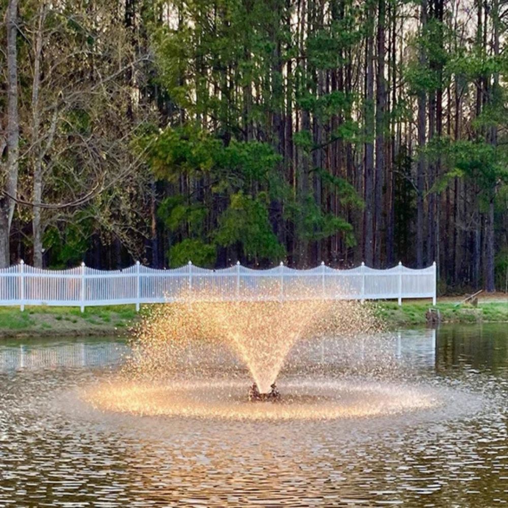 Bearon Aquatics Power House Aerating Fountain On The Water With A White Fence In The Background