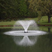 Bearon Aquatics Power House Aerating Fountain On The Water With Green Trees In The Background