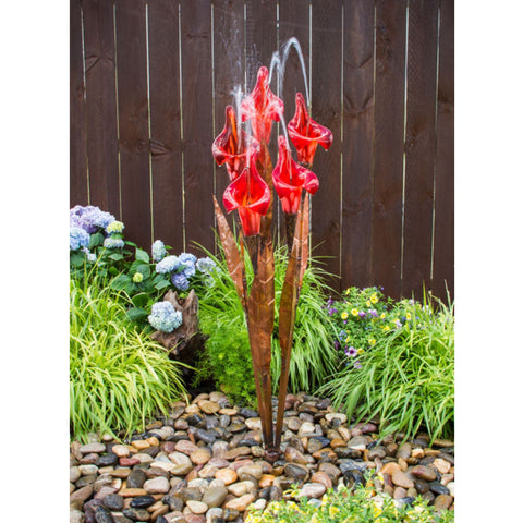 Blue Thumb 50 Copper Red Iris Flower Garden Fountain Surrounded By Plants With Wooden Fence In The Back
