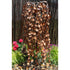 Thumbnail for Blue Thumb 60 Copper Weeping Elm Tree Garden Fountain Surrounded By Flowers And Green Plants With Wooden Fence In The Back