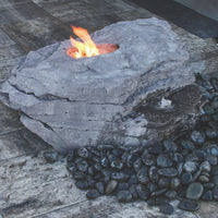 Thumbnail for Blue Thumb Boulder Outdoor Fire Stone Fountain With A Fire And Surrounded by Black Pebbles