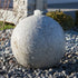 Thumbnail for Blue Thumb Granite Sphere Stone Fountain With Plants In The Background