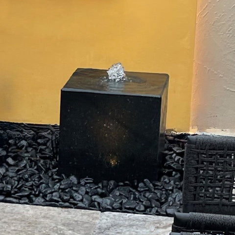 Blue Thumb Heiho Basalt Fountain With Warm Yellow Wall