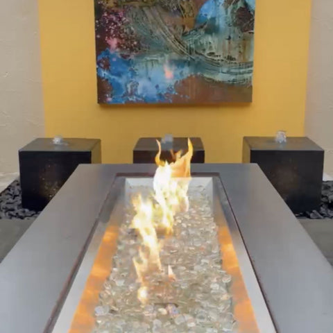 Blue Thumb Heiho Basalt Stone Outdoor Fountain With Modern Fire Pit, Wall Art And Yellow Accent Wall