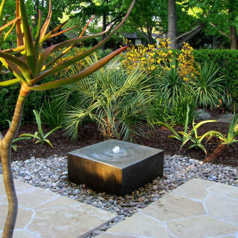 Blue Thumb Heiho Basalt Stone Outdoor Fountain With Tropical Plants And Natural Stone Flooring