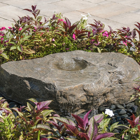 Blue Thumb Large Bird Bath Boulder Stone Fountain Surrounded By Bright Ornamental Plants