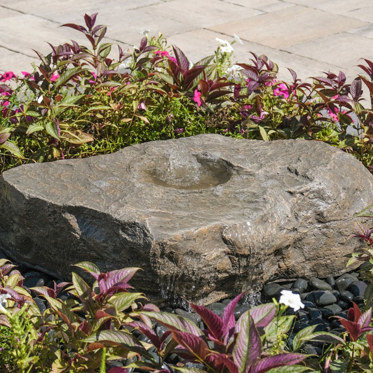 Blue Thumb Large Bird Bath Boulder Stone Fountain Surrounded By Bright Ornamental Plants