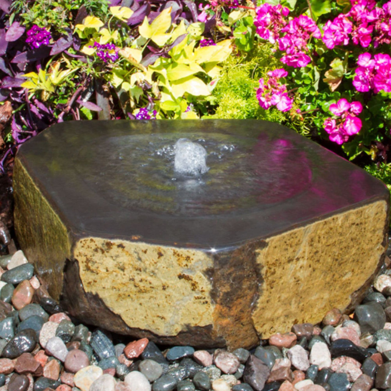 Blue Thumb Mizu Kasai Basalt Stone Garden Fountain With Colorful Plants And Flowers Behind