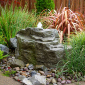 Blue Thumb Mountain Spring Rock Outdoor Fountain With Bright Landscaping