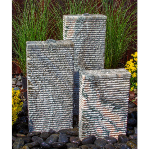 Blue Thumb Pink Marble Granite Stone Triple Fountain Besides Yellow Flowers And Green Grasses Behind