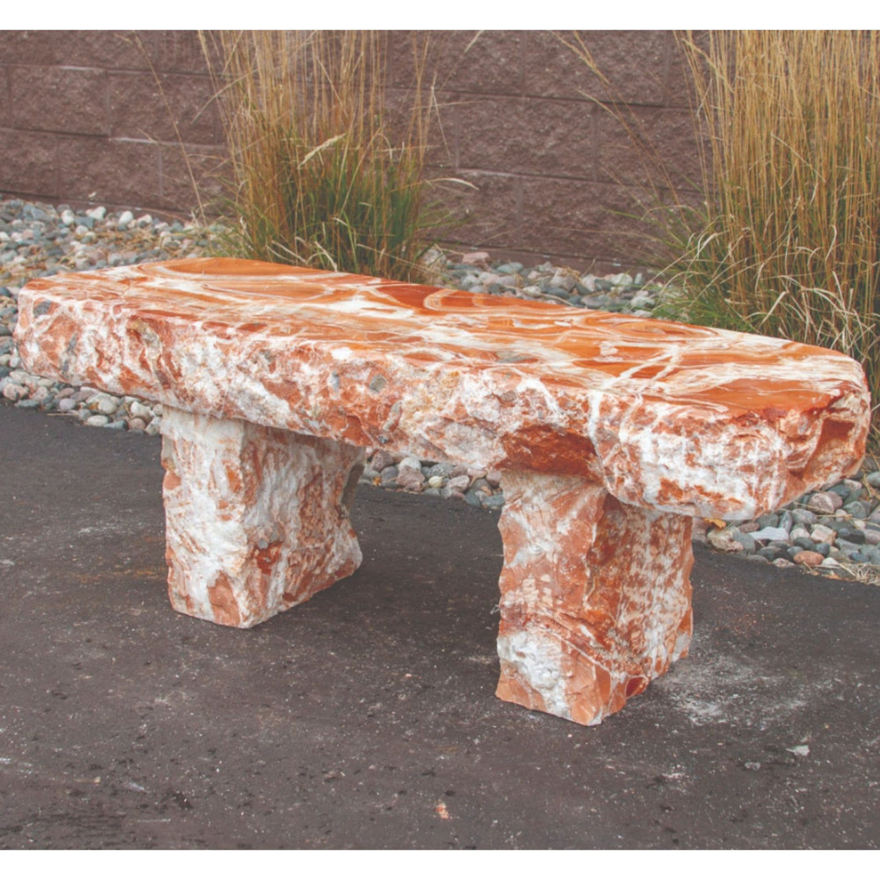 Blue Thumb Red Onyx Garden Bench With Pebble Border And Tall Grass Backdrop