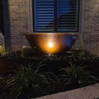 Thumbnail for Blue Thumb Rustic Sugar Kettle Powder-Coated Cast Iron Fountain With Light Accent And Brick Wall Behind