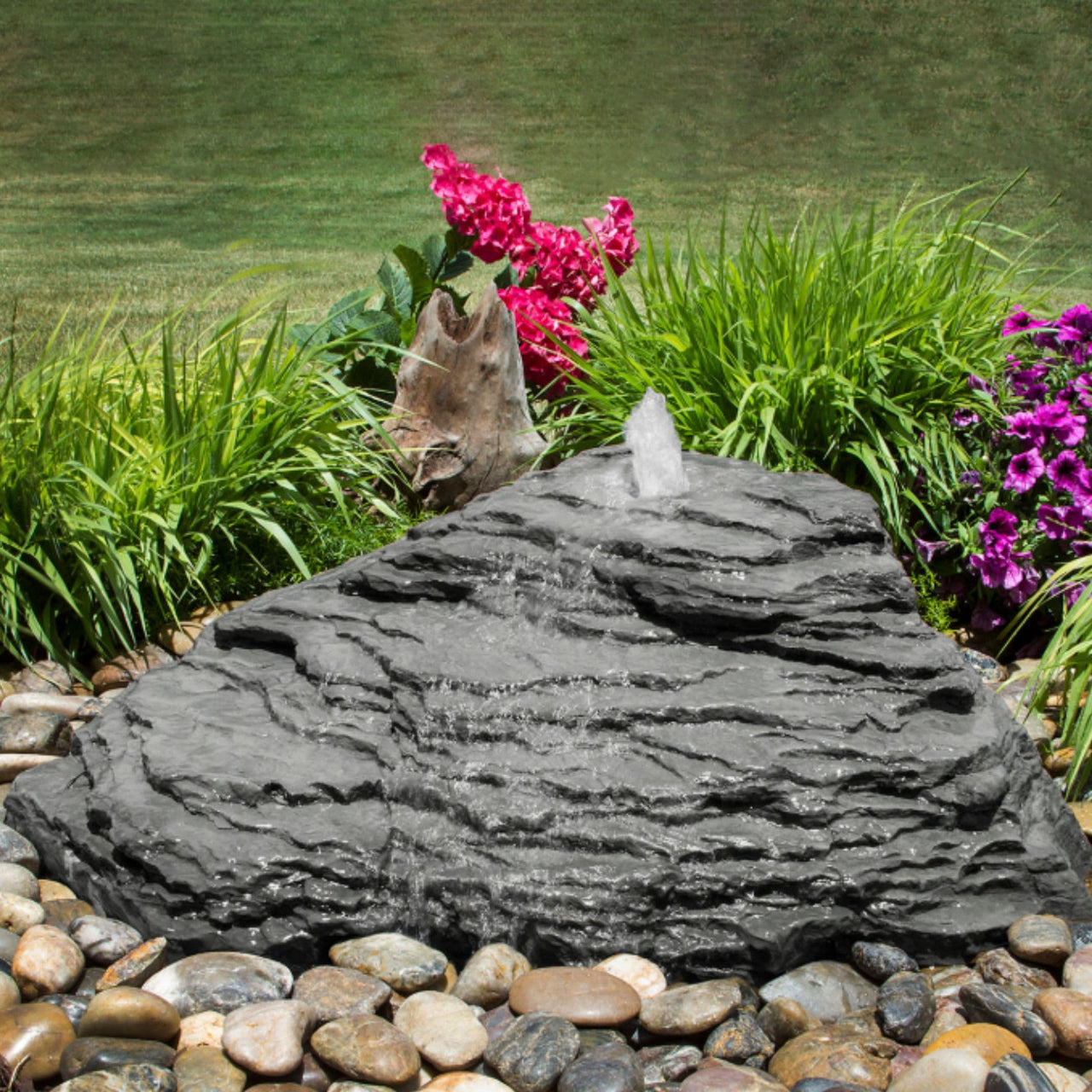 Blue Thumb Slate River Falls Stone Fountain Surrounded By Plants And Flowers