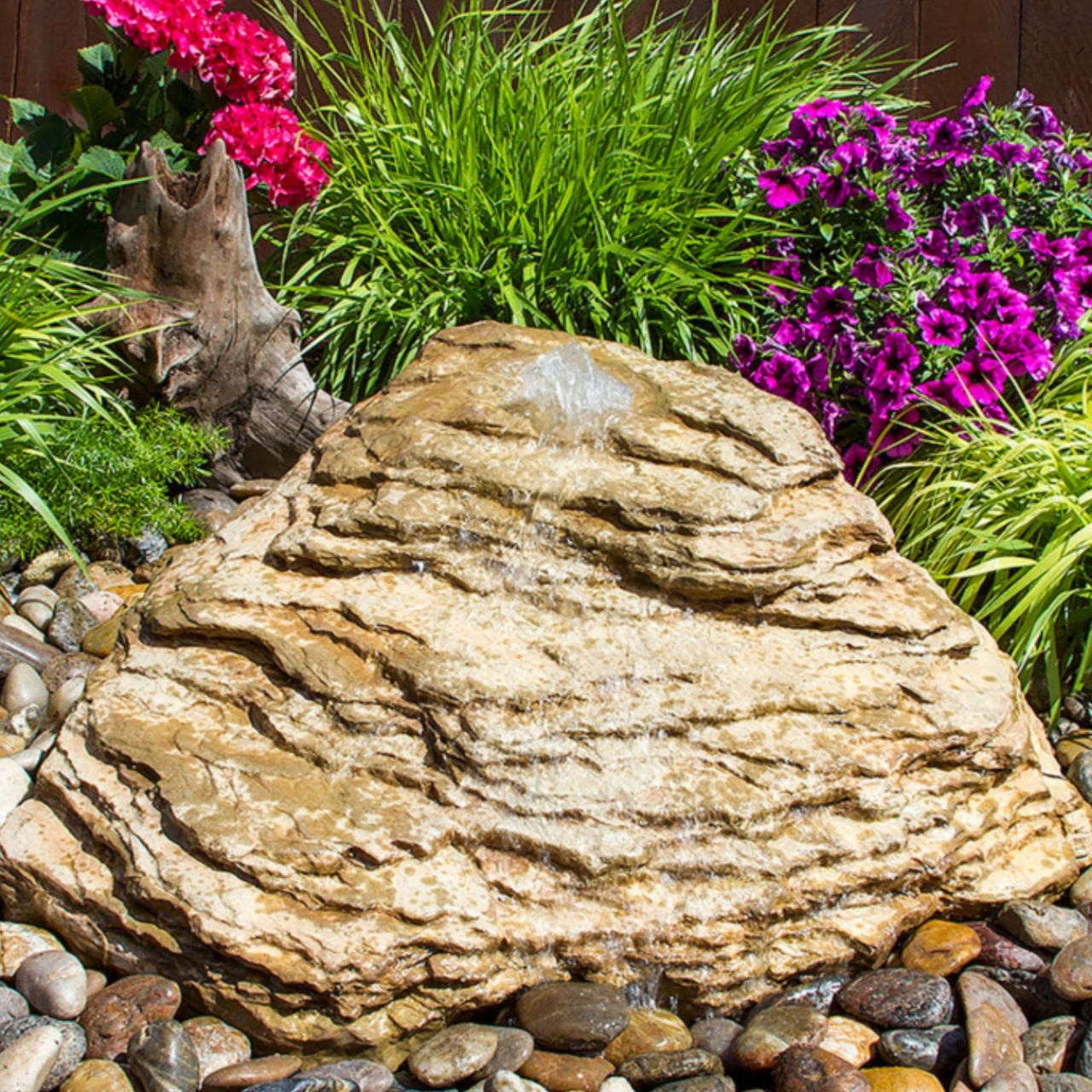 Blue Thumb Slate River Falls Stone Fountain With Colorful Flowers And Ornamental Plants