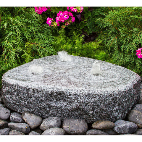 Blue Thumb Triple Circle Granite Stone Fountain With Shrubs And Flowers Background