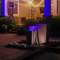 Thumbnail for Blue Thumb Triple Corten Steel Rusted Outdoor Fountain Surrounded By Flowers With Modern House And String Lights Background (1)