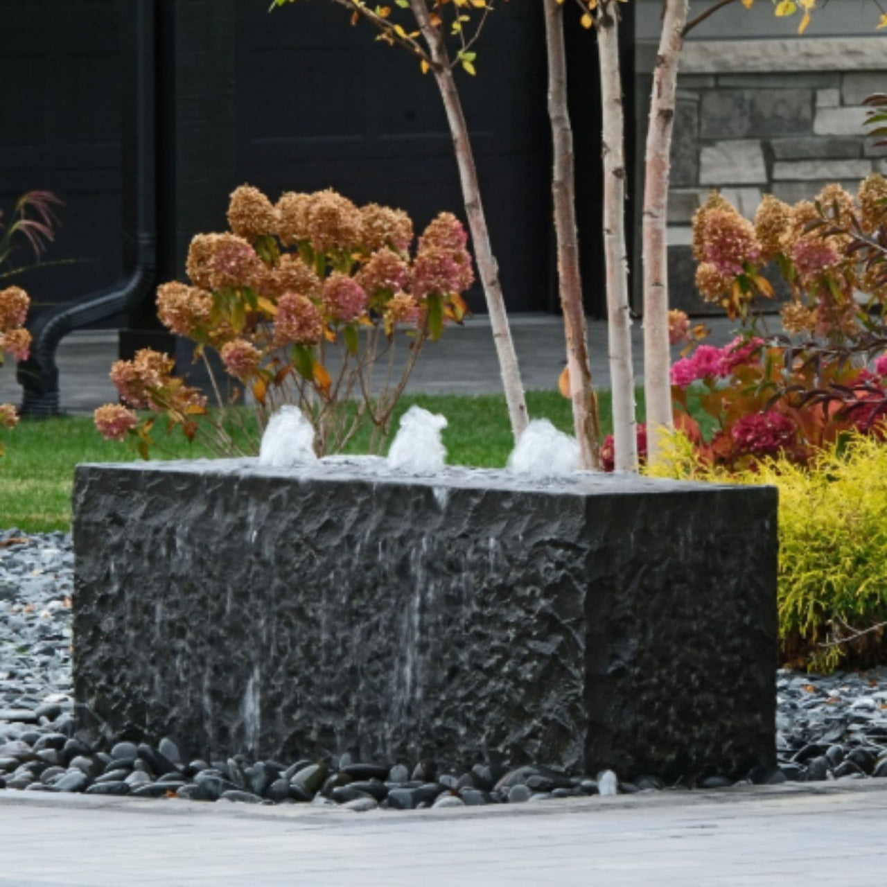Blue Thumb Triple Drilled Yasuyuki Stone Fountain With Colorful Plants And Autumn Trees Background View