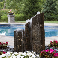 Thumbnail for Blue Thumb Triple Rustic Basalt Stone Outdoor Fountain Surrounded By Flowers With Pool Background