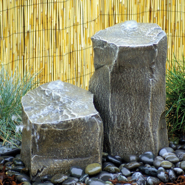 Blue Thumb Twin Peaks Stone Outdoor Fountain With Bamboo Fence Backdrop