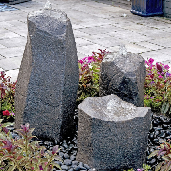 Blue Thumb Twisting Cascade Triple Stone Outdoor Fountain Surrounded by Colorful Plants
