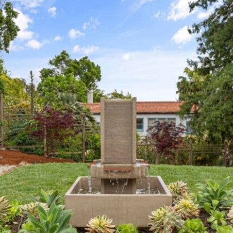 Brentwood courtyard fountain with central column and bowl With Lush Garden Surroundings