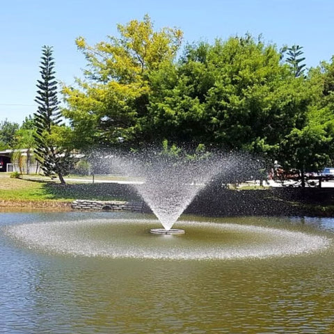 Cascade Saturn Pond Fountain On The Water With Trees In The Background