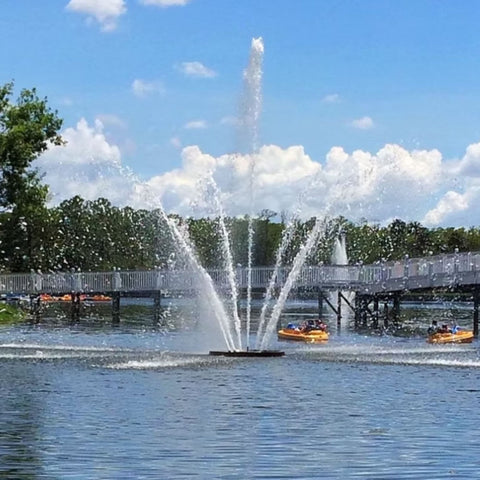 Cascade Libra Fountain With Bridge And Trees In The Background