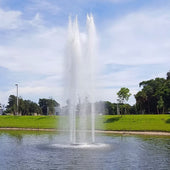 Cascade Orion Pond Fountain With Trees Under Clear Sky
