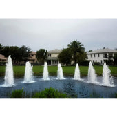 Cascade Single Jet Pond Fountain With Big Houses And Trees In The Background