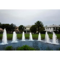 Thumbnail for Cascade Single Jet Pond Fountain With Big Houses And Trees In The Background