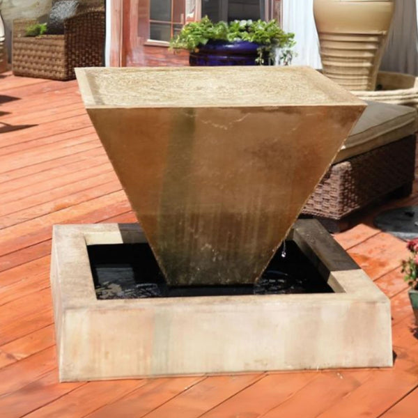 Compact Angled Oblique Outdoor Water Feature With Plants And Planters In The Background
