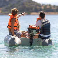 Thumbnail for Deluxe Inflatable Speed Boat With Four People Steering with the Boat Engine Visible
