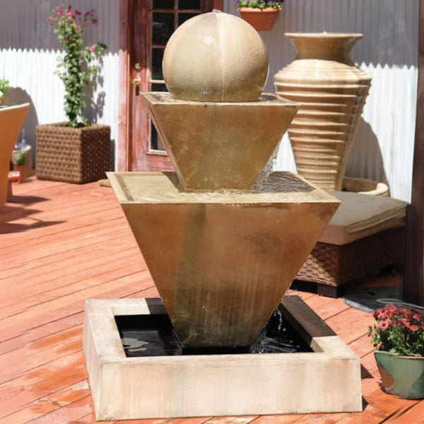 Double Oblique With Ball Outdoor Water Fountain By Gist With Door And A White Wall In T he Background