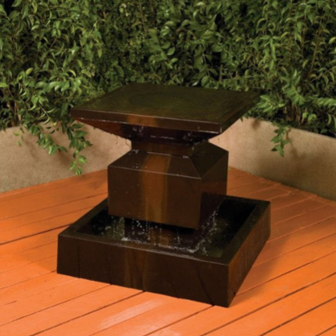 Elegant Classic Alaster Water Feature With Plants In The Background