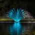 Thumbnail for Fern Premium Fountain Nozzle Beneath A Dark Night Sky With Vibrant Blue Reflections On Calm Water