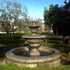 Thumbnail for Fiore Stone Formal Garden Fountain with Fiore Pond Surrounded By Grass With Trees In The Background