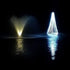 Thumbnail for Floating Christmas Tree On The Water With White Lights & A Fountain Beside It
