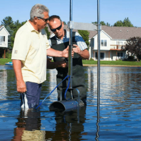 Free-Standing Post With Two Men Adjusting And Installing The Pond System